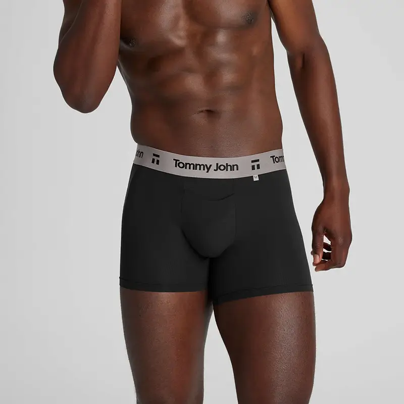 A man wearing a pair of Tommy John moisture-wicking Air Trunks.