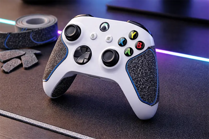 A gaming console controller with grip tape applied for sweaty hands